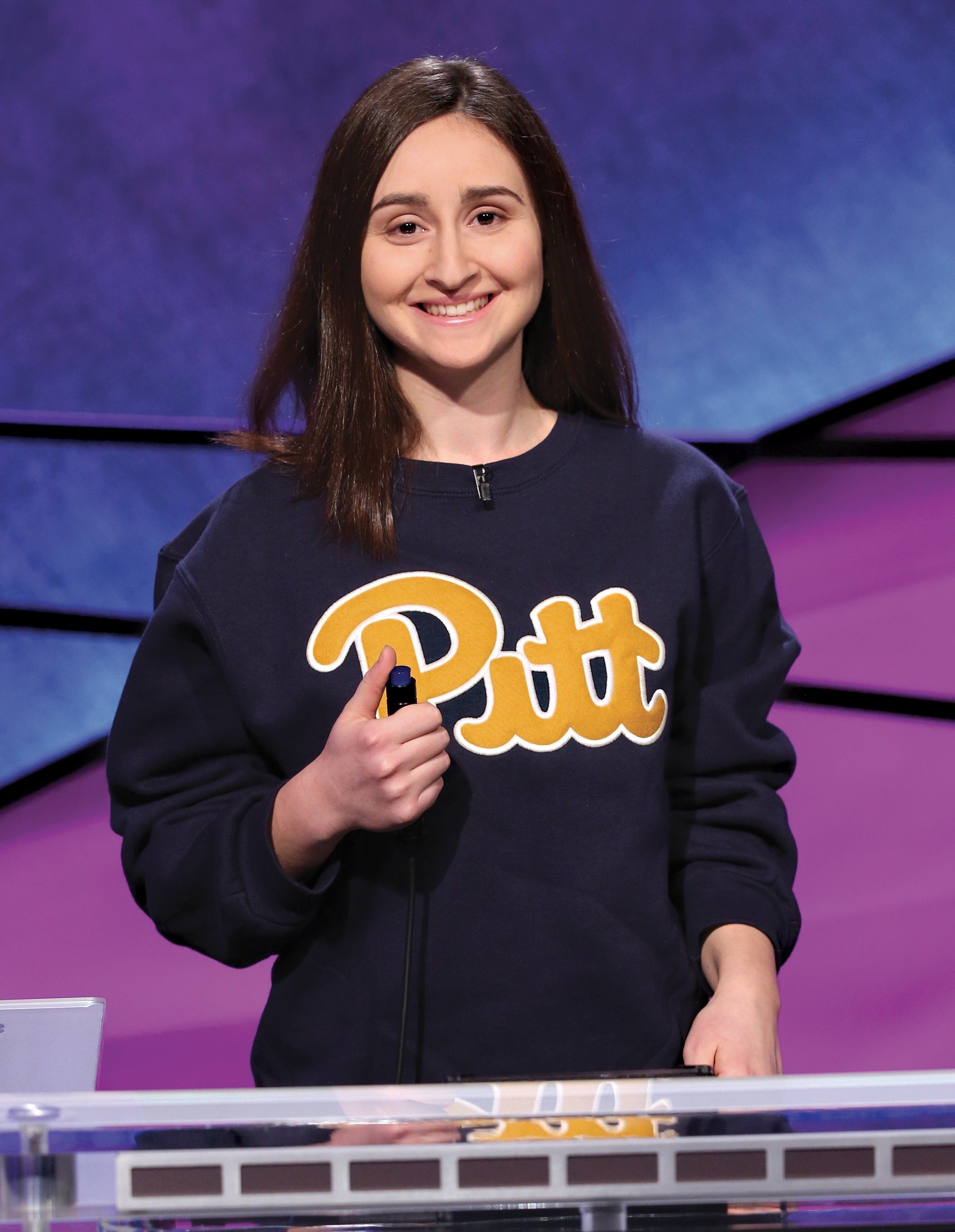 Sarah Dubnik in a Pitt script sweatshirt on the set of Jeopardy!