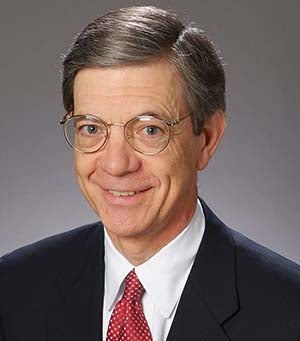 head shot of Michael Bryson, in suit and tie