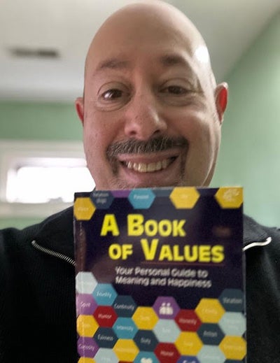 Kovitz poses with his A Book of Values