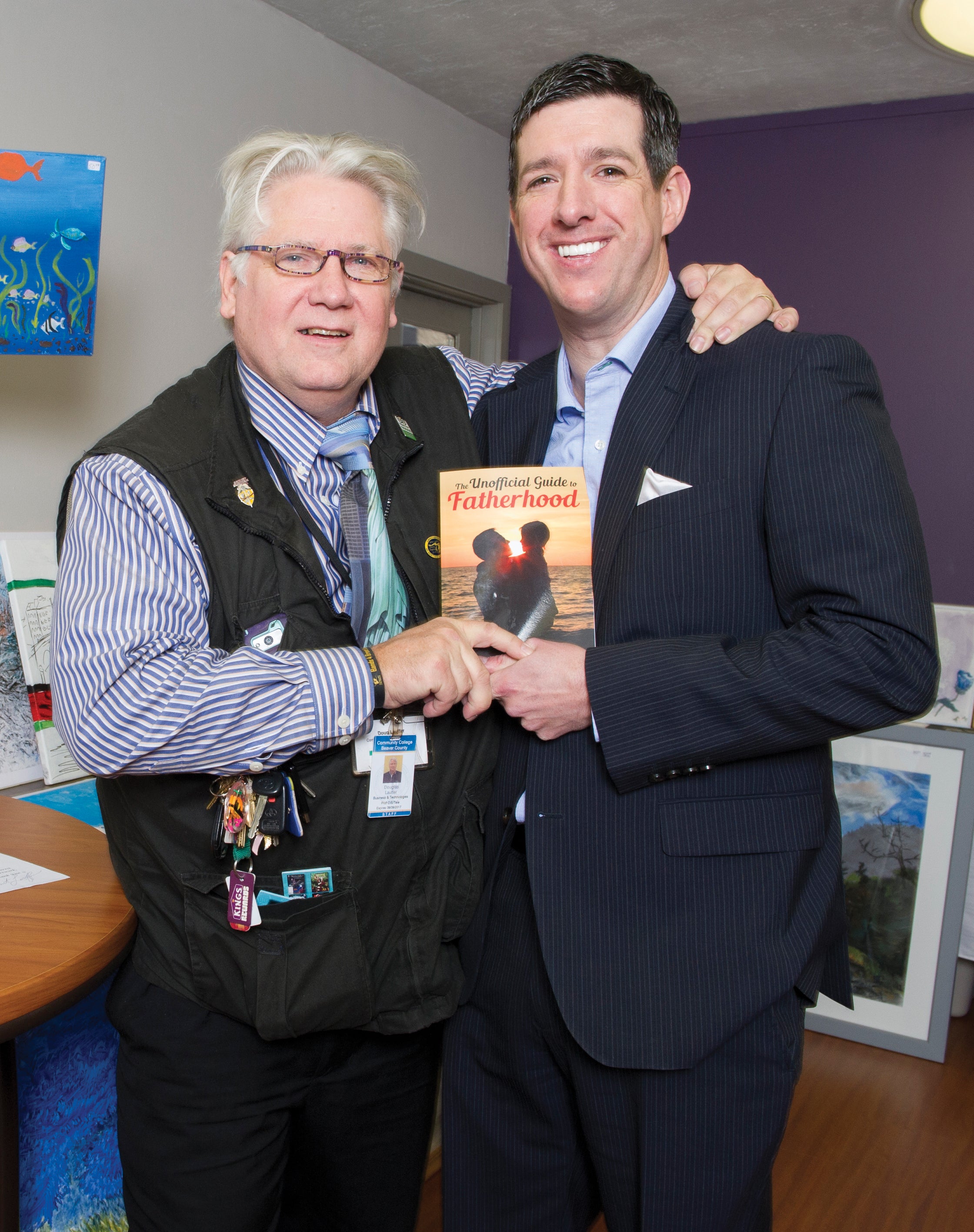 Douglas Lauffer and Dominick Domasky hold a copy of Domasky's book.