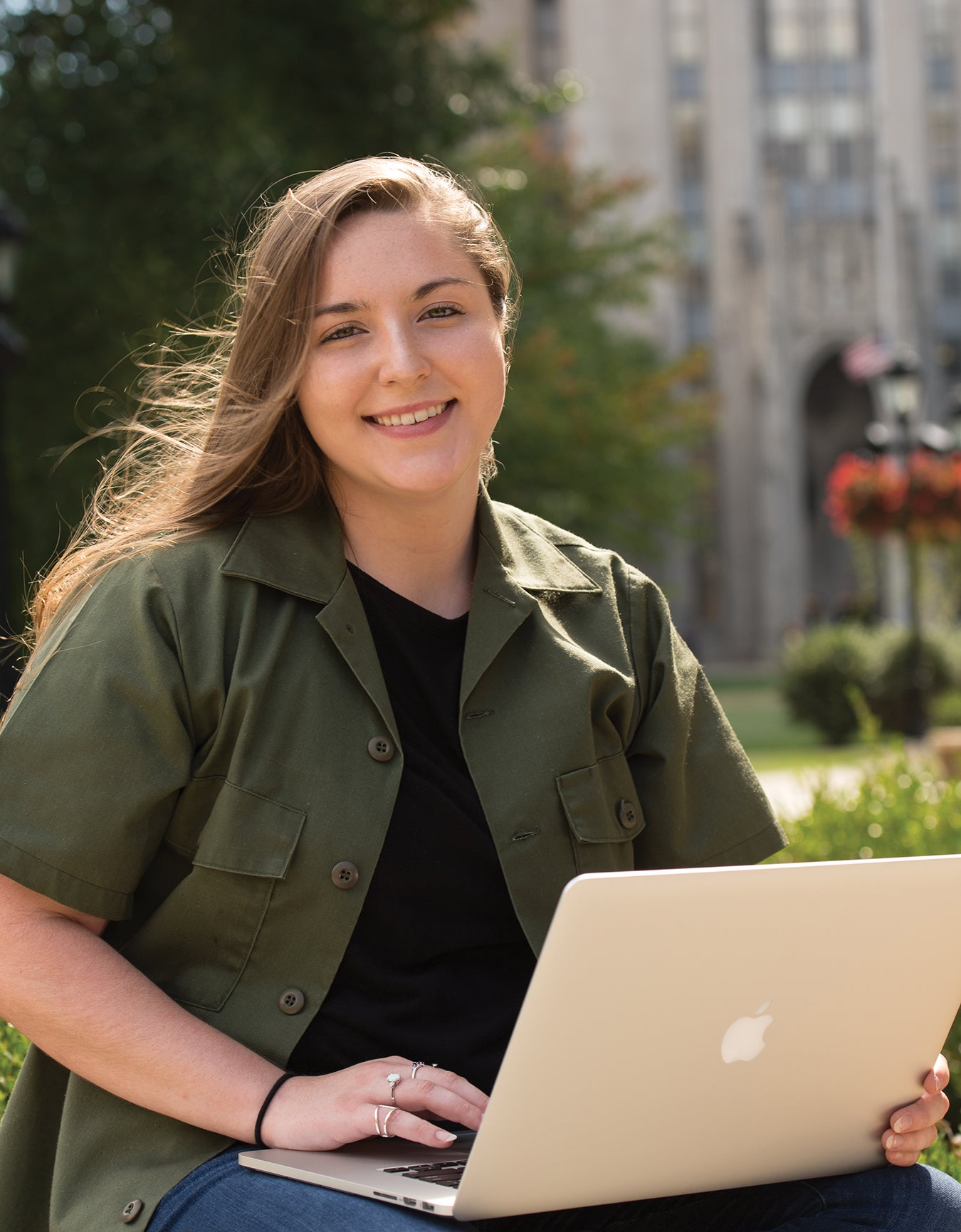 Michelle Ruoff on Pitt's campus with her computer