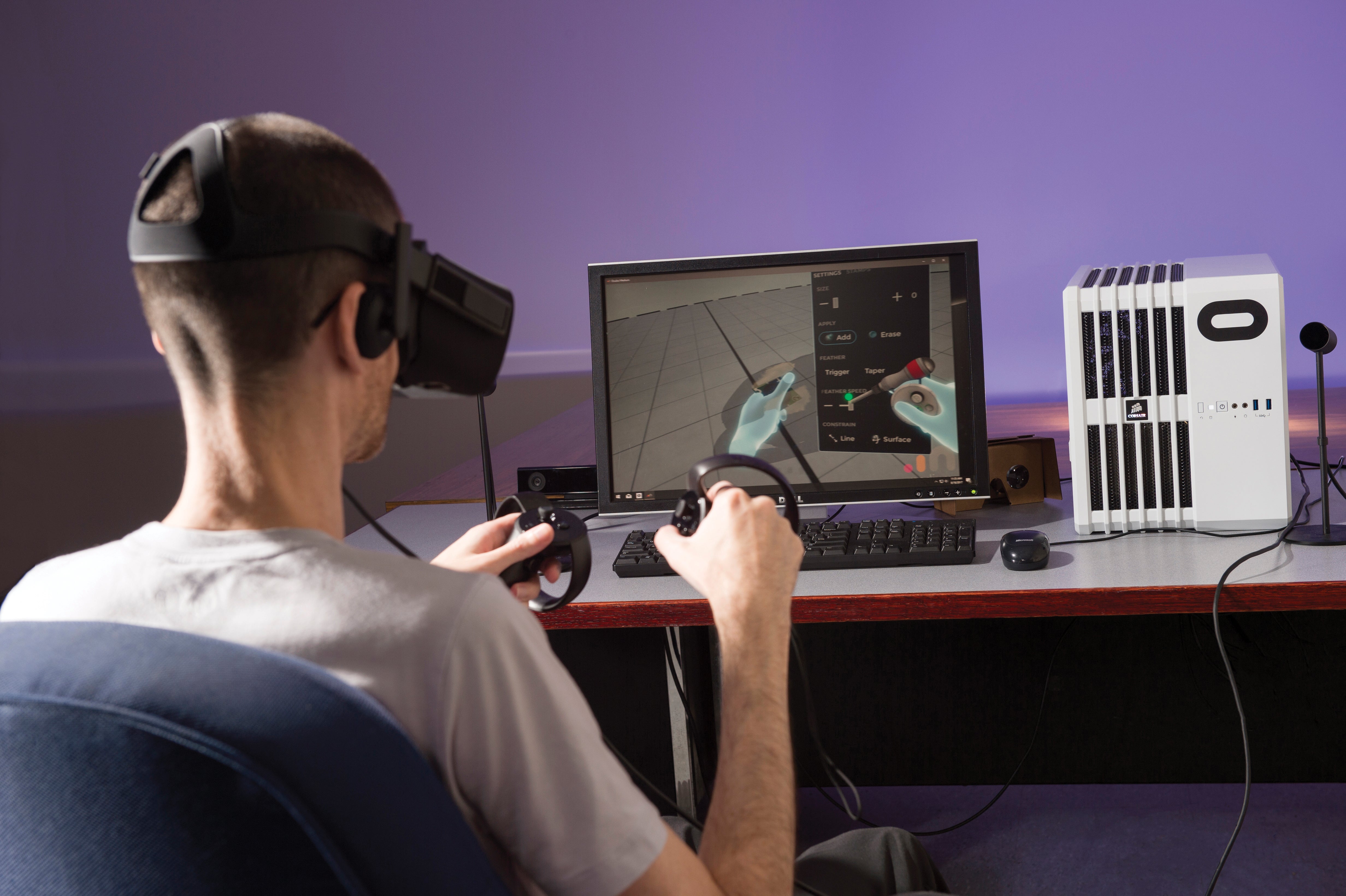 A man uses a virtual reality headset in the University's Open Lab.