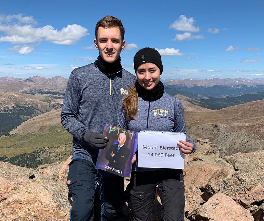 blue skies, fluffy clouds, rocky landscape, and lots of Pitt gear