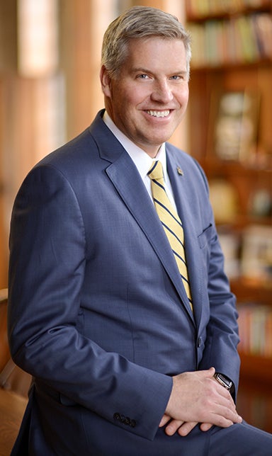 Chancellor Patrick Gallagher in suit in professional portrait