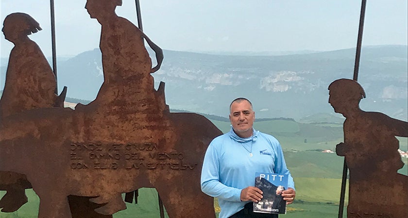 A long walk goes well with a good read, and that's just what William L. Brown III (ENGR ’81) had when he brought Pitt Magazine along on a 500-mile, 32-day trek from St. Jean Pied de Port, France, to Santiago, Spain. Here, he stops for a break on the top of the Alto del Perdón in Zariquiegui, Spain.