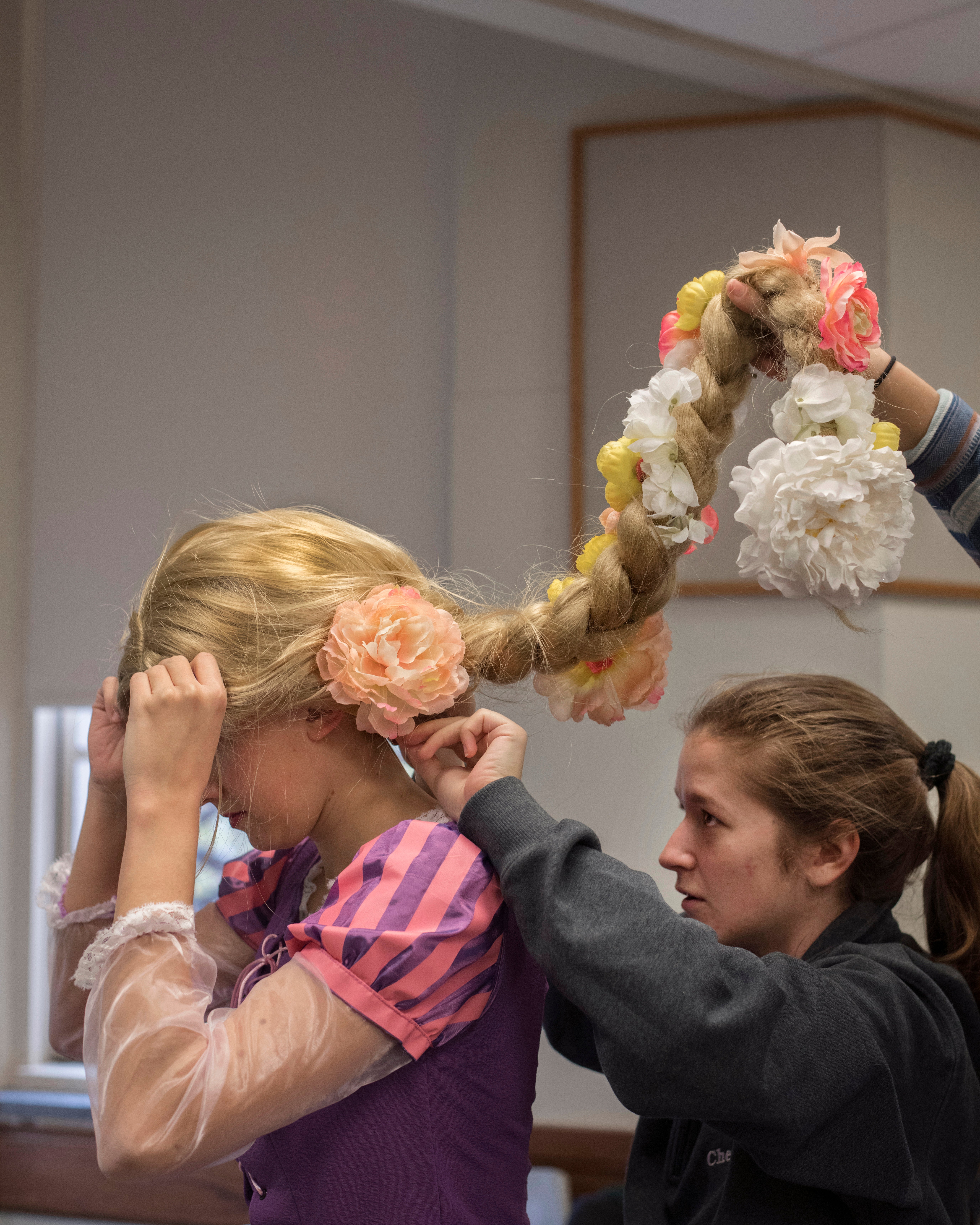 Julia Driscoll (right), TIP board member and chemistry major, helps bioengineering major Daniela Krahe get into character.