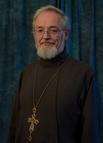 Webster in clergy robes