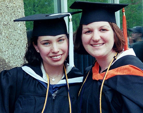 Wydra and Vogler in graduate regalia