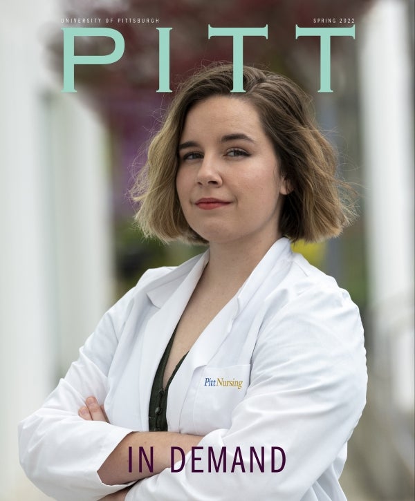 Pitt Magazine Spring 2022 cover, "In Demand," shows young woman in white Pitt Nursing coat