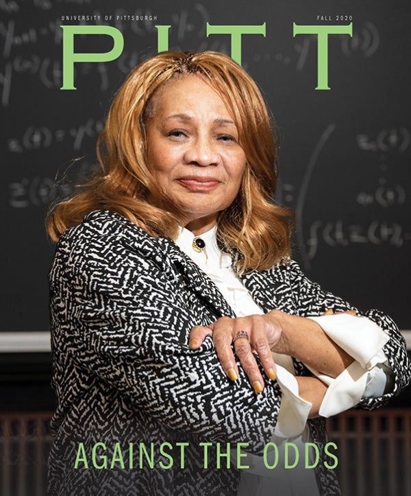 Pitt Magazine Fall 2020 cover, Against the Odds, Elayne Arrington in front of a blackboard with math equations