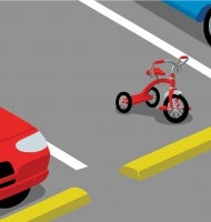 A red tricycle with streamers sits in a parking space between a blue car and a white car.