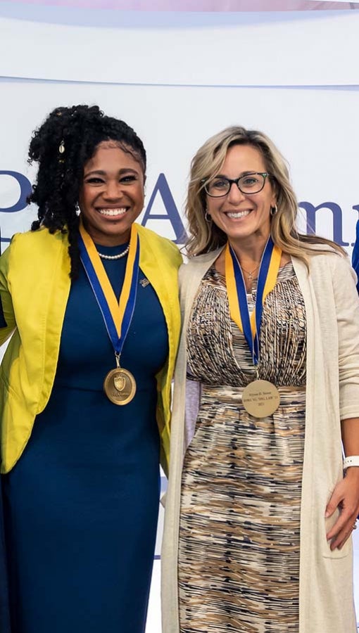 Shannon Finley and Alyson D. Stover wear gold medals