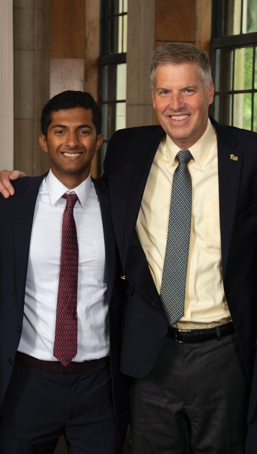 Joseph Kannarkat and Chancellor Patrick Gallagher,in the Chancllor's office in the Cathedral of Learning.