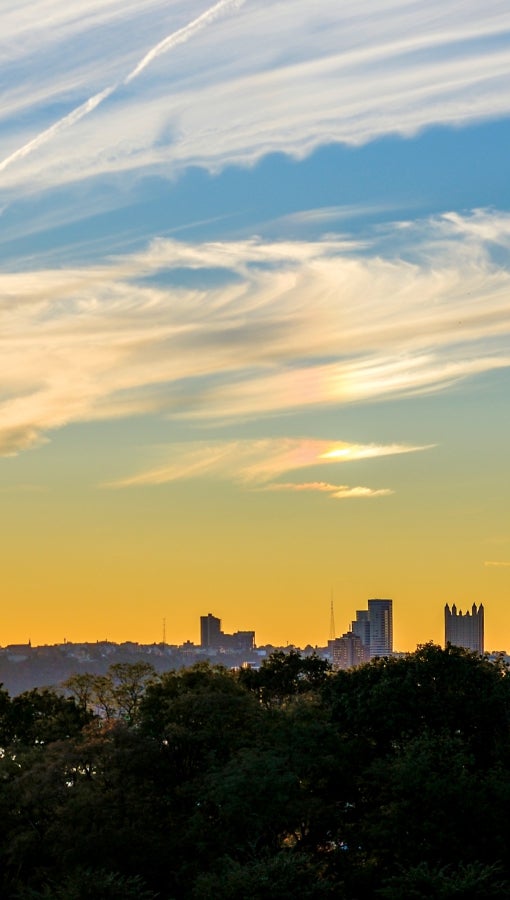 A low sun over the hills surrounding Pittsburgh