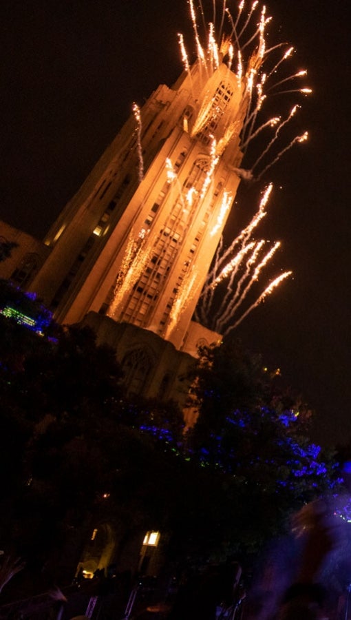 Fireworks going off at the Cathedral of Learning