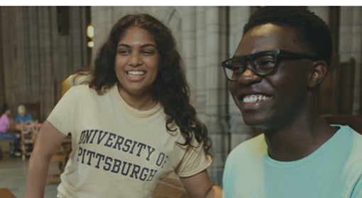 young woman wearing University of Pittsburgh T-shirt and young man wearing mint green shirt