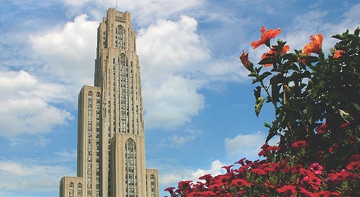 Cathedral of Learning flanked by summertime flowers