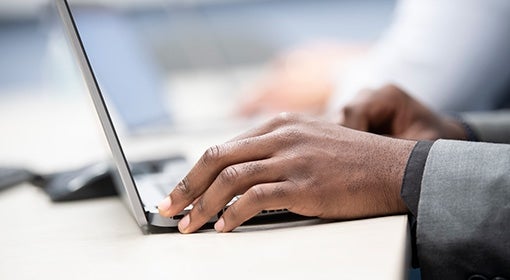 Hands on a laptop