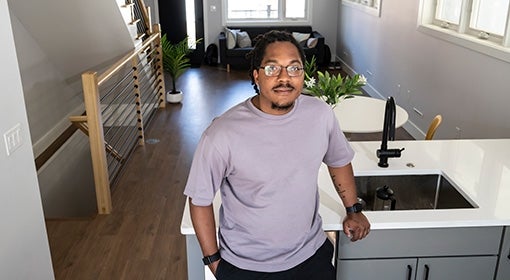 Cofer leans on a kitchen counter