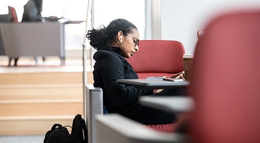 A person studies in an academic building