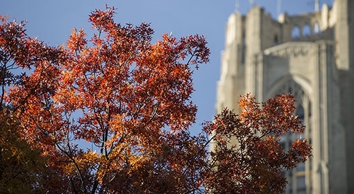 Cathedral of Learning with orange and red foliage