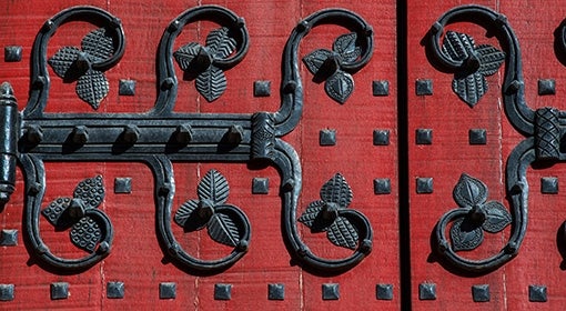 A red door with iron details