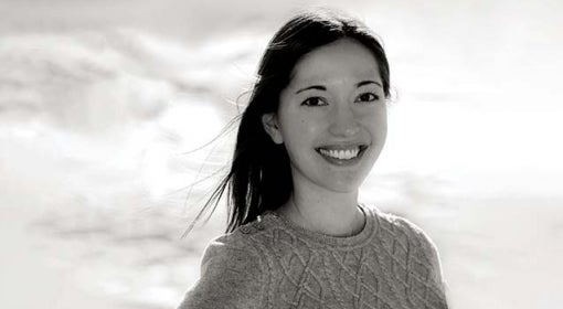 black and white author portrait of woman smiling for camera