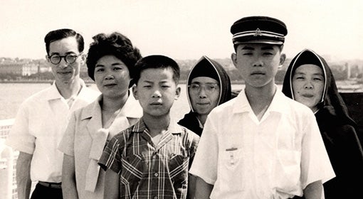 A black and white photograph of a Japanese family