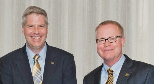 Brownlee (right) with Chancellor Patrick Gallagher