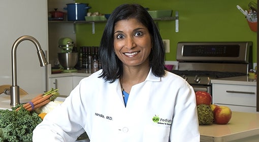 Nimali Fernando, aka Dr. Yum, sits in her office kitchen.