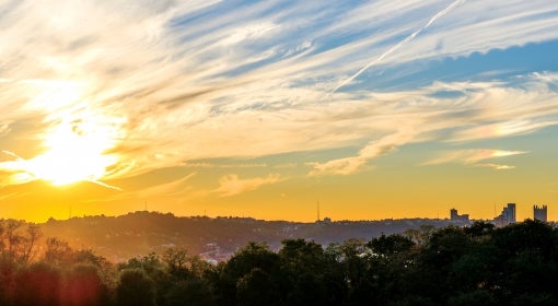 A low sun over the hills surrounding Pittsburgh