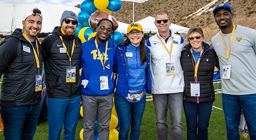 People pose in Pitt attire