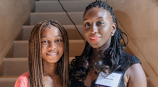 Omolara Oni and Aisha Shettima in front of steps in Heinz Memorial Chapel