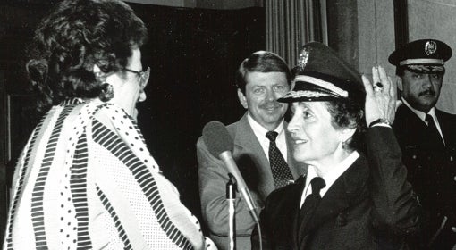 Rocco is sworn in in her police dress uniform, her left hand raised