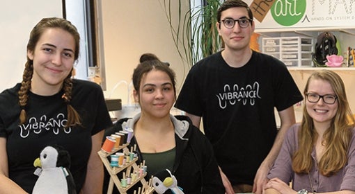 The team, from left: Jocelyn Dunlap, Natalie Neal, Jesse Rosenfeld, Caroline Westrick, Samosky, Issam Abushaban and Thomas Driscoll in the Art of Making studio, with backpack monkeys, electronics, fabric, spools of thread spread out on a table