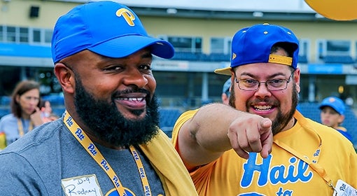 odney Hill (UPJ ’07) and Steve Harrison (right) get pumped up before the 100th meeting of Pitt and Penn State at the Pitt Alumni Association Tailgate, one of the football tailgate events hosted by the PAA each year.