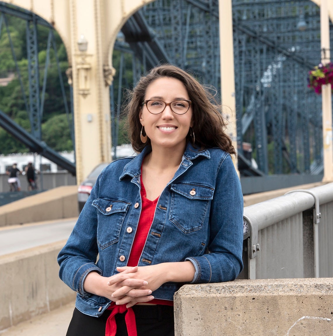 Jenna Baron in front of one of Pittsburgh's many bridges