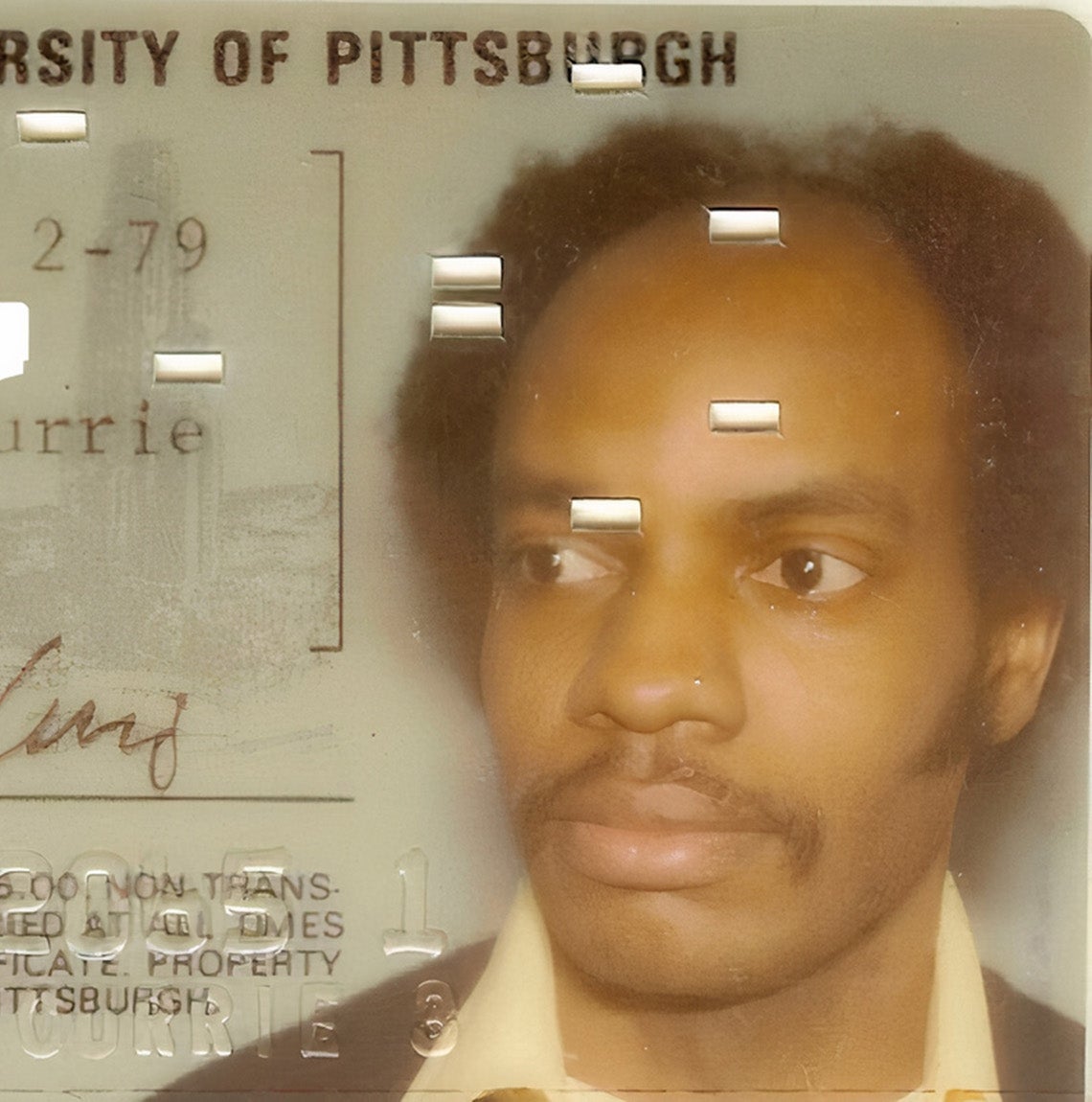 Glossy photo school ID from 1979 for Melvin R Currie, student, with his signature